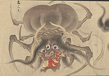 A photo of the Dust Spider from the story: The Tale of the Dust Spider. It has a demon like face with 3 eyes and a gaping red mouth with fangs, and horns.